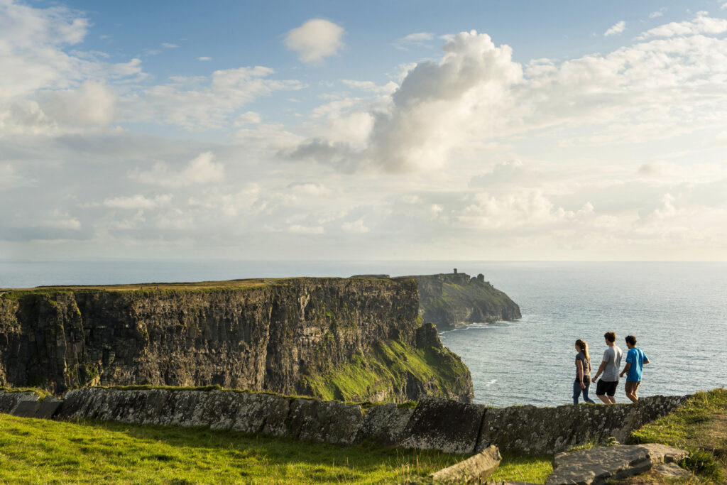Friends walking the cliff top walk along the Cliffs of Moher Co Clare TI72HED